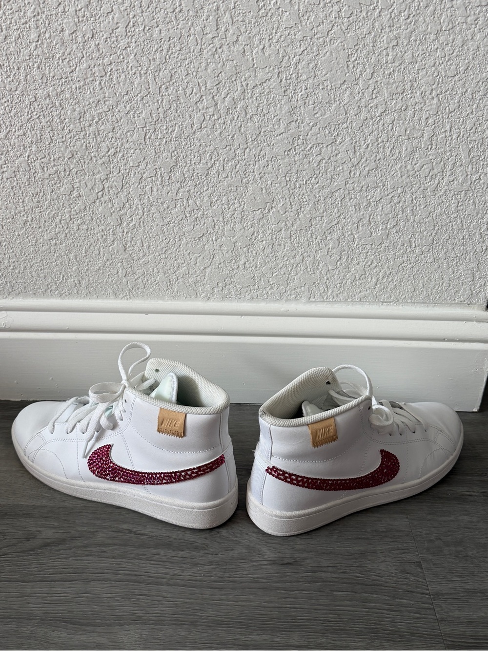 Nike Women’s White High-Top Sneakers with Hot Pink rhinestone Swoosh